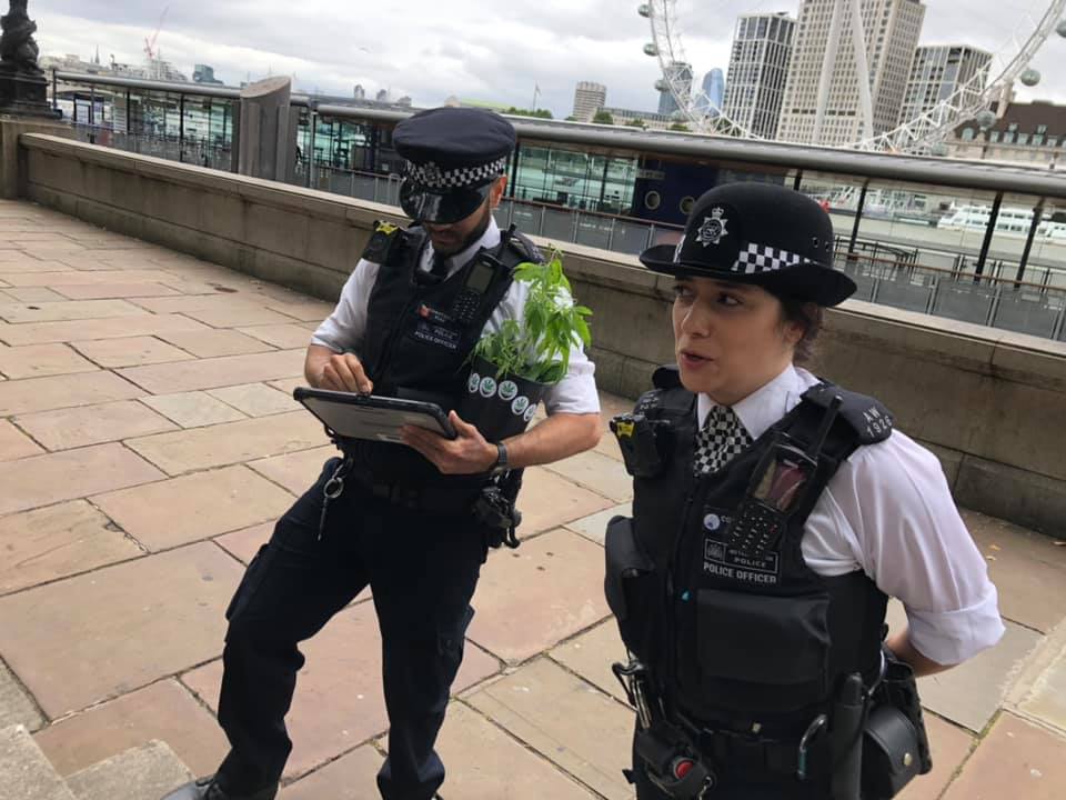 two police officers outside New Scotland Yard at Hemp Rebellion protest